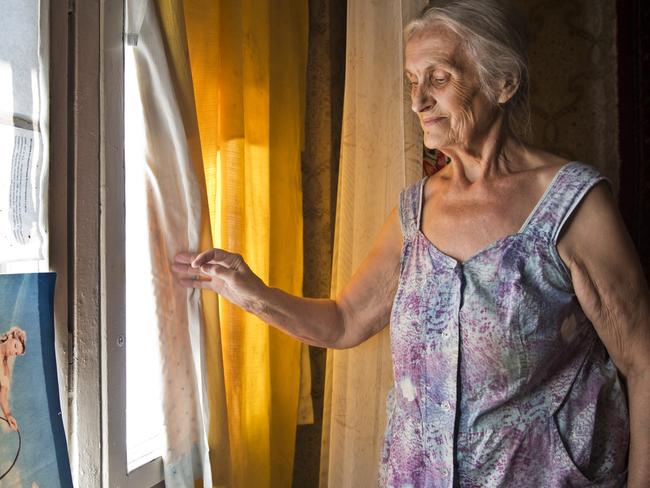 22 July 2014. DONETSK, UKRAINE. Valentina Kozlovaâ€™s world was already grey but now she will have to live in darkness as she has no money to repair all the windows of her home unit that were shattered when a mortar landed outside. But that is the least of 76-year-old great grandmother's problems - her grandson Vlad was outside at the time. Pic Ella Pellegrini