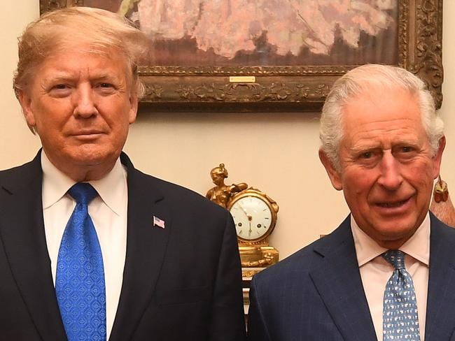 Britain's Prince Charles, Prince of Wales (2nd R) and Britain's Camilla, Duchess of Cornwall (R) meet US President Donald Trump (2nd L) and US First Lady Melania Trump (L) pose for a photograph at Clarence House in central London on December 3, 2019, ahead of the NATO alliance summit. - NATO leaders gather Tuesday for a summit to mark the alliance's 70th anniversary but with leaders feuding and name-calling over money and strategy, the mood is far from festive. (Photo by Victoria Jones / POOL / AFP)