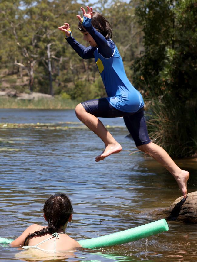 Kids cooling off in Parramatta Lake. Picture: Damian Shaw