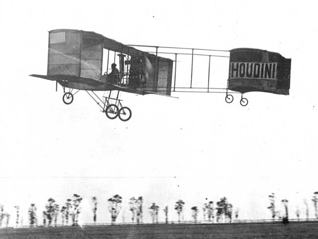 American escapologist Harry Houdini flying his Voison plane at Diggest Rest, just outside Melbourne, in 1910.