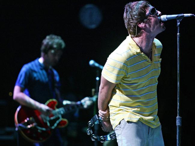 (FILES) British Liam (R) and Noel Gallagher, members of group "Oasis" perform during their concert at the Benicasim International Festival in Benicasim, Castellon, August 7, 2005. British rock legends Oasis announced on August 27, 2024 they will reunite for a worldwide tour next year, as brothers Liam and Noel Gallagher ended an infamous 15-year feud to unveil plans to return to the stage. The band, which helped create the Britpop era of the 1990s with hit songs "Wonderwall", "Don't Look Back In Anger" and "Champagne Supernova", announced on X it will play gigs in Cardiff, Manchester, London, Edinburgh and the Irish capital, Dublin. (Photo by JOSE JORDAN / AFP)