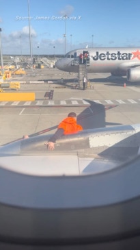 Jetstar Passenger opens emergency exit on plane, goes down emergency slide