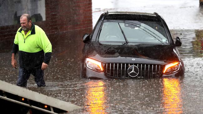 A Mercedes is swamped in South Melbourne on Friday. Picture: David Crosling