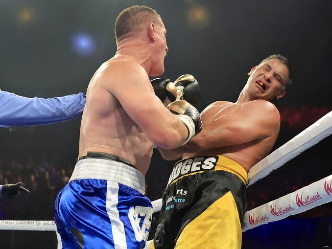 Paul Gallen lands a shot on Justin Hodge. Picture: Mark Evans/Getty Images