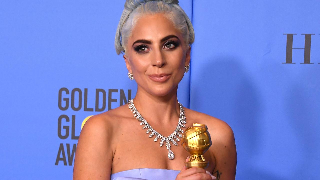 Winner for Best Original Song - Motion Picture for "Shallow - A Star is Born" Lady Gaga poses with the trophy during the 76th annual Golden Globe Awards on January 6, 2019, at the Beverly Hilton hotel in Beverly Hills, California. (Photo by Mark RALSTON / AFP)