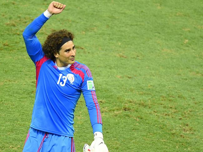 Mexico's goalkeeper Guillermo Ochoa gestures after a Group A football match between Brazil and Mexico in the Castelao Stadium in Fortaleza during the 2014 FIFA World Cup on June 17, 2014. AFP PHOTO / FABRICE COFFRINI