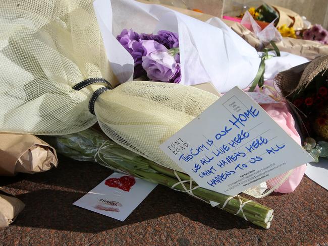 A poignant message on flowers at the Bourke St shrine. Picture: Yuri Kouzmin