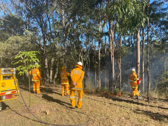 Queensland Rural Fire Service firefighters conducting a hazard reduction burn. Photo: Queensland RFS