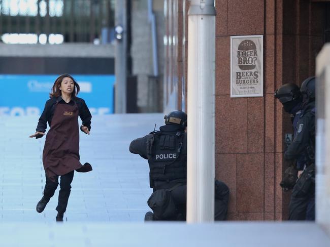 Elly Chen escapes from the Lindt Cafe in Martin Place. Picture: Adam Taylor.