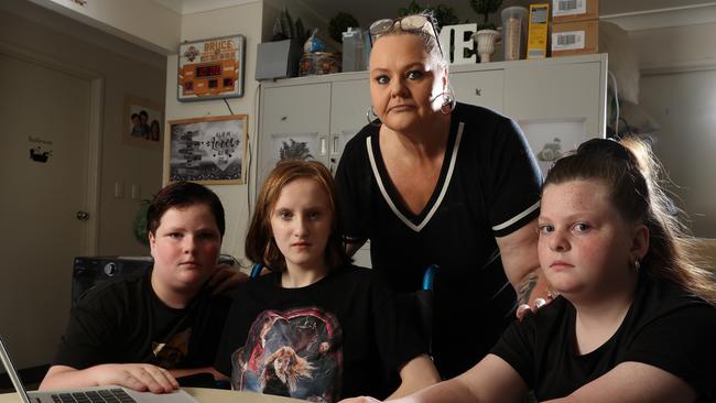 Mum Lenice Davidson with her kids Chelsea, Angel-Rose, and Tye, struggling to purchase technology for her kids for school, Brighton. Picture: Liam Kidston