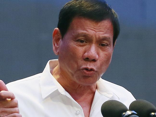 FILE - In this Oct. 13, 2016 file photo, Philippine President Rodrigo Duterte gestures during his address to a Filipino business sector in suburban Pasay city south of Manila, Philippines. This week's visit to China by Duterte points toward a restoration of trust between the sides following recent tensions over their South China Sea territorial dispute, China's official news agency said Tuesday, Oct. 18. (AP Photo/Bullit Marquez, File)