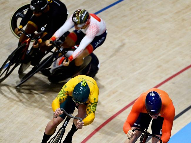 Netherlands' Harrie Lavreysen (R) and Australia's Matthew Richardson (L) sprint as Britain's Jack Carlin, Malaysia's Muhammad Shah Firdaus Sahrom and Japan's Shinji Nakano (rear) crash during the men's track cycling keirin final. Picture: John Macdougall / AFP