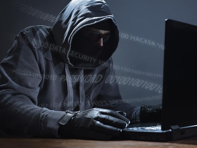 BUSINESS SCAM  ..  Hacker stealing data from a laptop