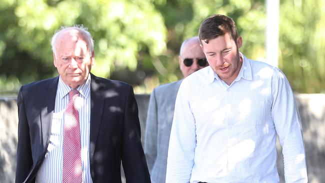 Horse trainer Ben Currie (right) with his legal representative QC Jim Murdoch arrives at the Queensland Racing Integrity Commission.