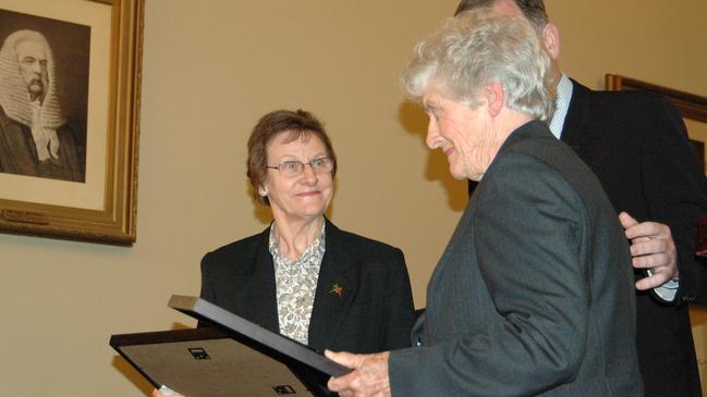 Bettye Arthur (left) and Betty Everett each received a framed copy of an official pardon of Colin Ross in 2008. Picture: Simon Mossman