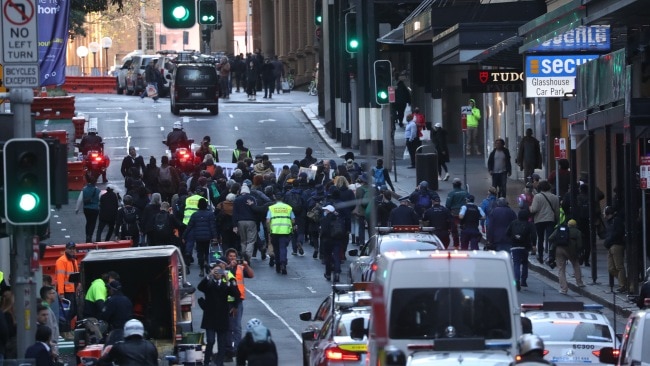 Dozens of Blockade Australia protesters running through the streets of Sydney on Monday morning in a bid to cause "mass disruptions" this week. Picture: John Grainger