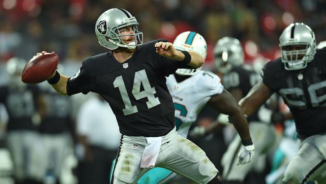 Oakland Raiders' Matt McGloin passes the ball during the NFL football game against Miami Dolphins at Wembley Stadium in London, Sunday, Sept. 28, 2014. (AP Photo/Tim Ireland)