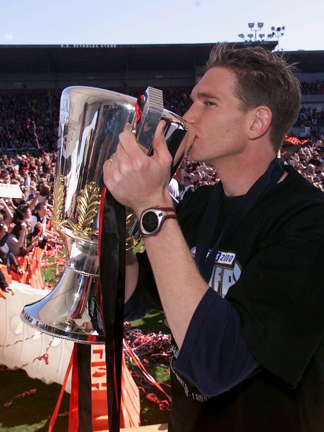 Hird kisses the premiership cup after the Bombers defeated Melbourne in the 2000 AFL Grand Final. Photo: Graham Crouch.