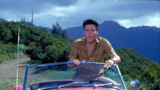 Elvis and his red MG in Blue Hawaii, 1961.