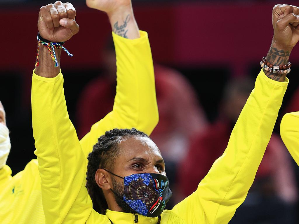 Patty Mills raises his hands in triumph. Pics Adam Head