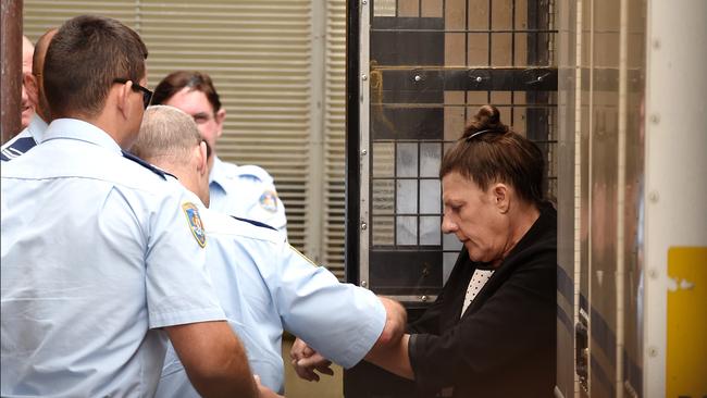 Fiona Barbieri is led from a corrective services van at the Supreme Court after pleading guilty to killing police officer Bryson Anderson. Picture: Dan Himbrechts