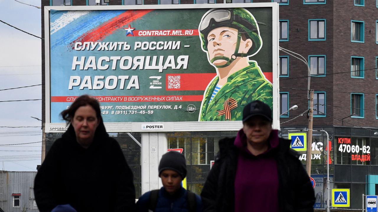 A billboard reading ‘Serving Russia is a real job’ in Saint Petersburg. Picture: Olga Maltseva / AFP