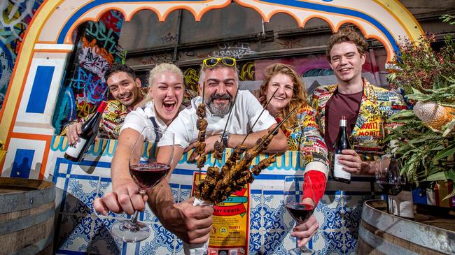 Movida's Frank Cammora (centre) with staff Antonie, Lucy and Josephine get ready for their Spanish street party on Hosier Lane. Picture: Trim Carrafa