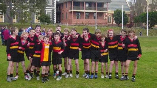 St Joseph's under-12 photo. Tom Atkins is in back row poking his tongue out, Tom McCartin is in front with vertical stripes, Paddy McCartin sixth from the right