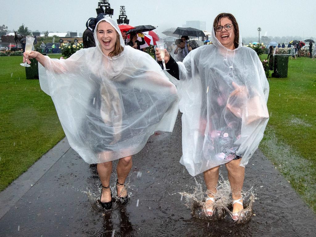 These two women don’t care if it rains on their parade. Picture: Jason Edwards