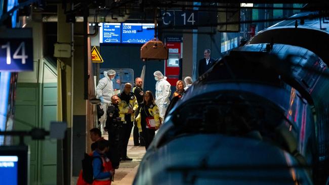 Police investigate on the railway platform at Hamburg's main train station. Picture: Jonas Walzberg / AFP