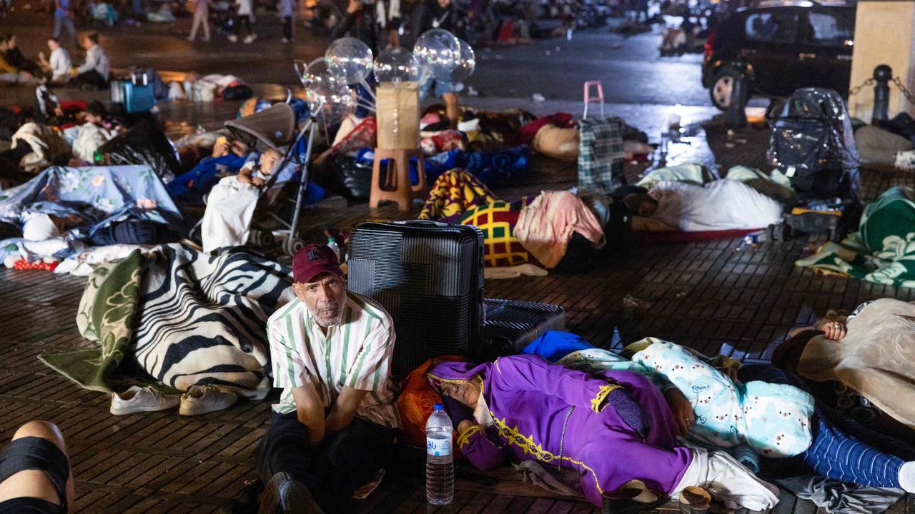 Residents take shelter ouside at a square following an earthquake in Marrakesh on September 9, 2023 after a 6.8-magnitude quake. (Photo by Fadel SENNA / AFP)