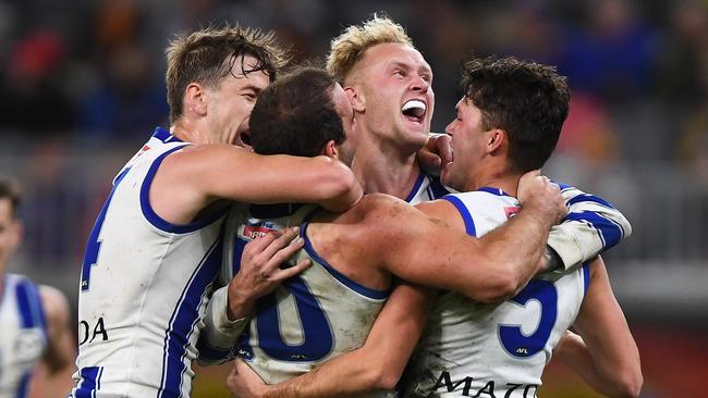 Jaidyn Stephenson and his teammates celebrate their surprise win over the West Coast in Perth.