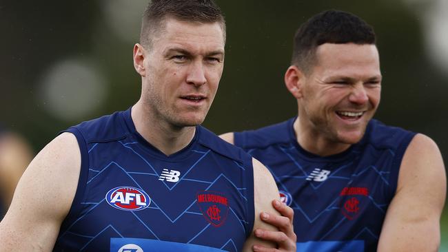 Tom McDonald with Steven May on the training track at Casey Fields. Picture: Daniel Pockett/Getty Images