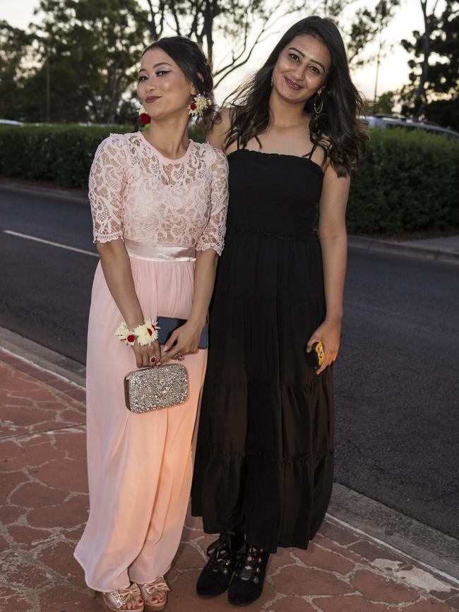 Naz Gul Nazari (left) and Mannat Vidding at Centenary Heights State High School formal at Picnic Point, Friday, November 20, 2020. Picture: Kevin Farmer