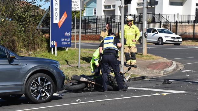 Emergency services have responded to a crash involving a ute and a motorcycle at the intersection of Stephen and West streets in South Toowoomba on July 23, 2024.