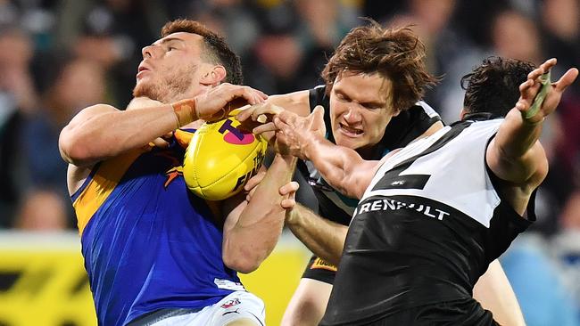 Jared Polec of the Power tackles Luke Shuey. (Photo by Daniel Kalisz/Getty Images)