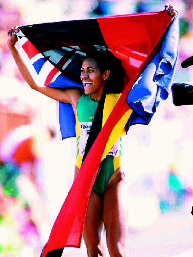 Cathy Freeman double-flag celebration at the 1994 Commonwealth Games