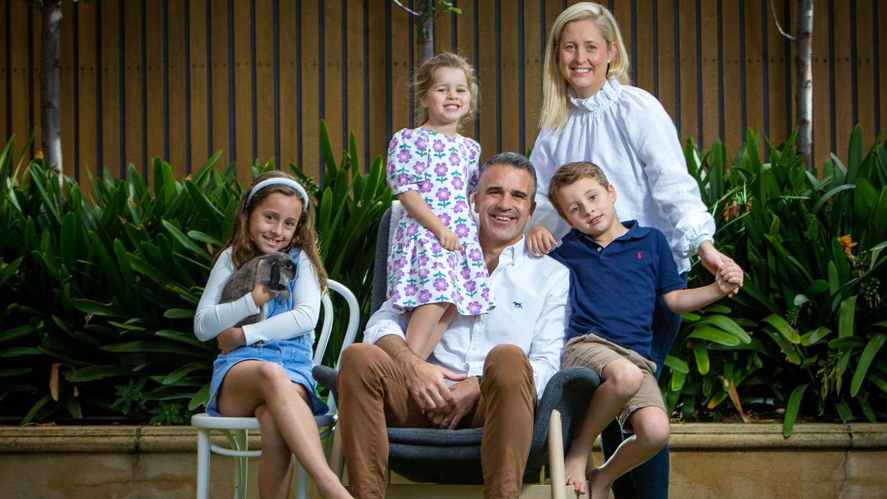 Peter and Annabel Malinauskas with their children Sophie, 8, holding Charlie the rabbit, Eliza, 3, and Jack, 5, at home in Bowden, SA. Picture: Emma Brasier