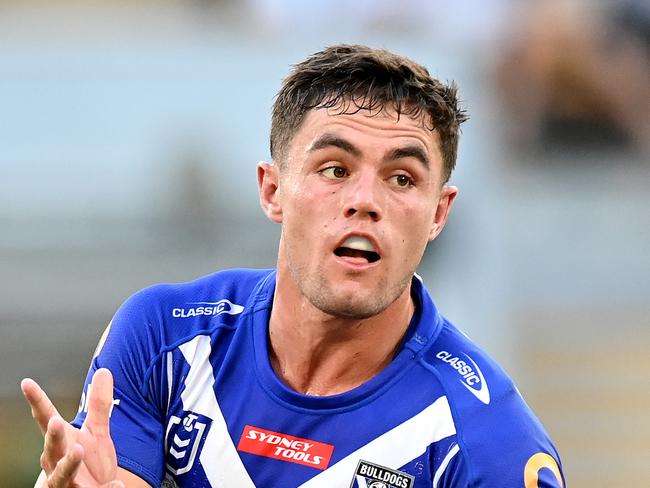 BRISBANE, AUSTRALIA - MARCH 27: Kyle Flanagan of the Bulldogs passes the ball during the round three NRL match between the Brisbane Broncos and the Canterbury Bulldogs at Suncorp Stadium on March 27, 2021, in Brisbane, Australia. (Photo by Bradley Kanaris/Getty Images)