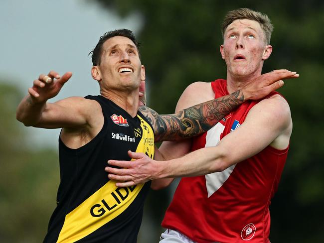 11/06/18 - SANFL match between Glenelg and North Adelaide at Glenelg Oval.  Glenelg's Jesse White and North's Alexander Barns compete in the ruck. Picture: Tom Huntley