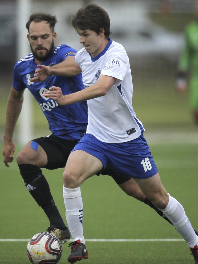 Hamish McCabe under pressure from Comets’ Andreas Wiens. Picture: AAP/Dean Martin