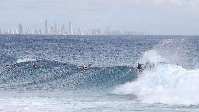 Surfers at Snapper Rocks and Kirra riding the Large swell produced by Cyclone OMA. Photograph : Jason O'Brien