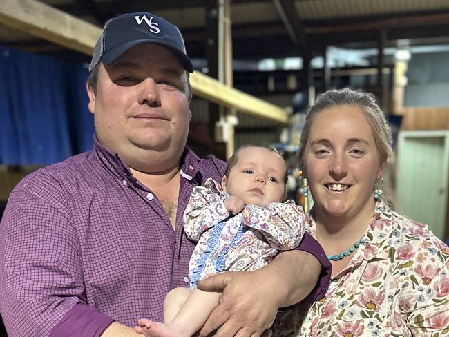 CAPTION: Crystal Bell, with four-month-old daughter Eva and partner Geordie Elliott. The new mother has recently been awarded an international title for her Murray Grey stud stock. PICTURE: Supplied.