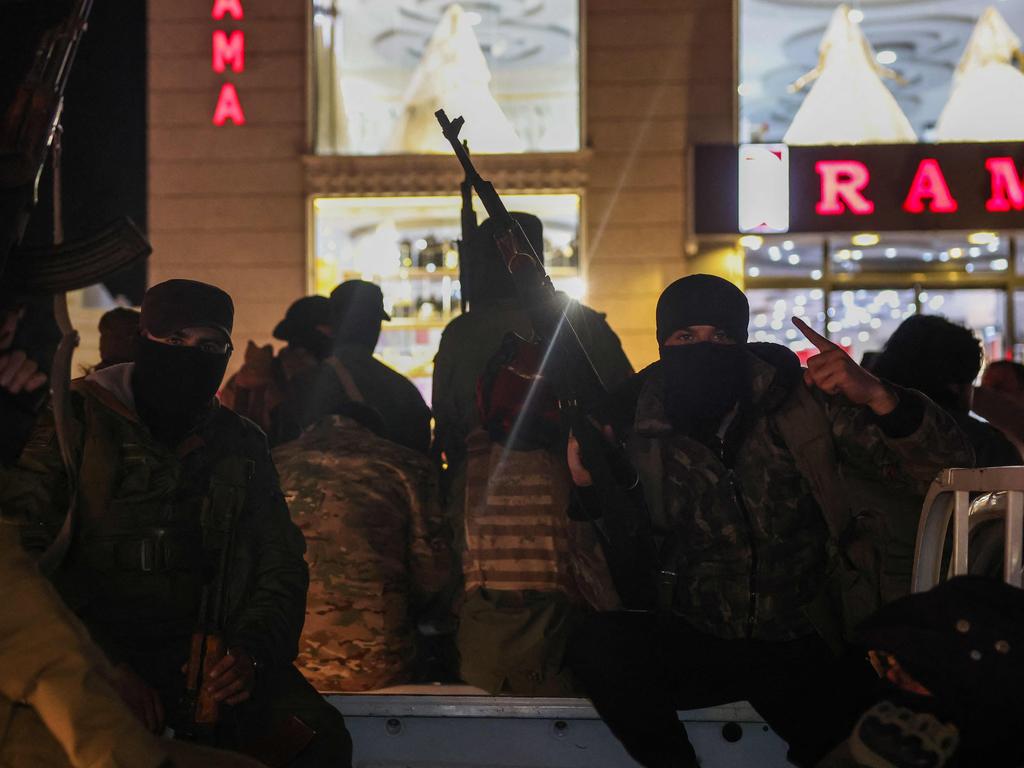 Members of Syria's new security forces prepare to depart from the northwestern city of Idlib, as reinforcement for the coastal area. Massacres of unarmed civilians have been reported. Picture: AFP