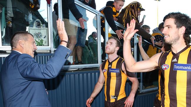 Former Hawks skipper enjoys a win in Tasmania with Tom Mitchell and Ben Stratton.