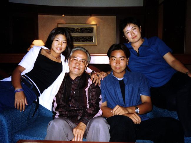 Penny Wong (r) with sister Ying Soon, father Francis Wong and brother Kein Peng in Malaysia in 2002.