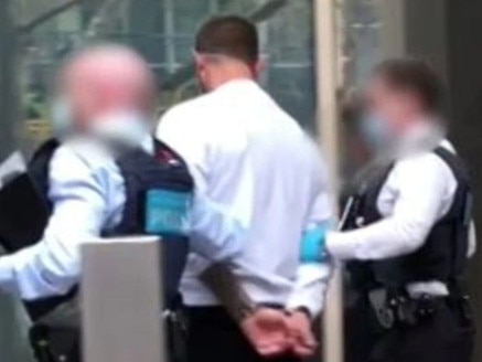 Dale David Williams is escorted while in custody with the Australian Federal Police. Picture: Supplied