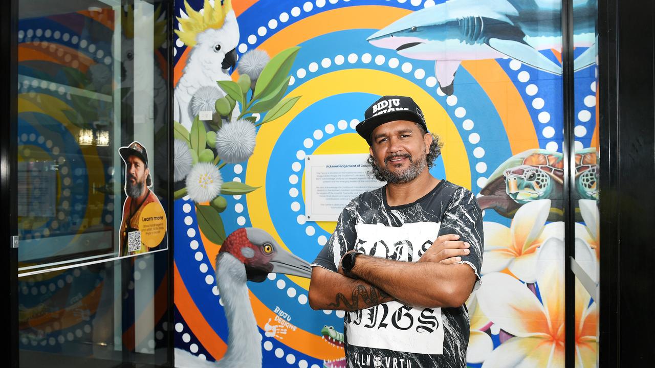 Local Artist Nicky Bidju Pryor, in front of his First Nation's mural that speaks to Wulgurukabra, Bindal and Torres Strait Islander communities in partnership with Townsville Shopping Centre. Picture: Shae Beplate.