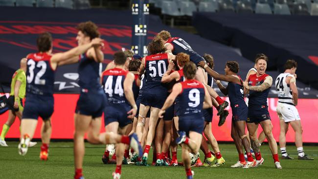 The Demons celebrate after Max Gawn kicked a goal after the final siren to win the minor Premiership. Picture: Michael Klein