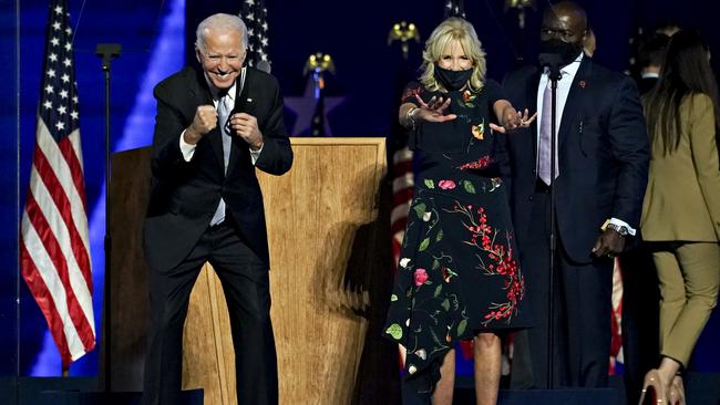 US President-elect Joe Biden, left, and wife Jill Biden gesture to the audience during an election event in Wilmington, Delaware, after claiming victory. Picture: